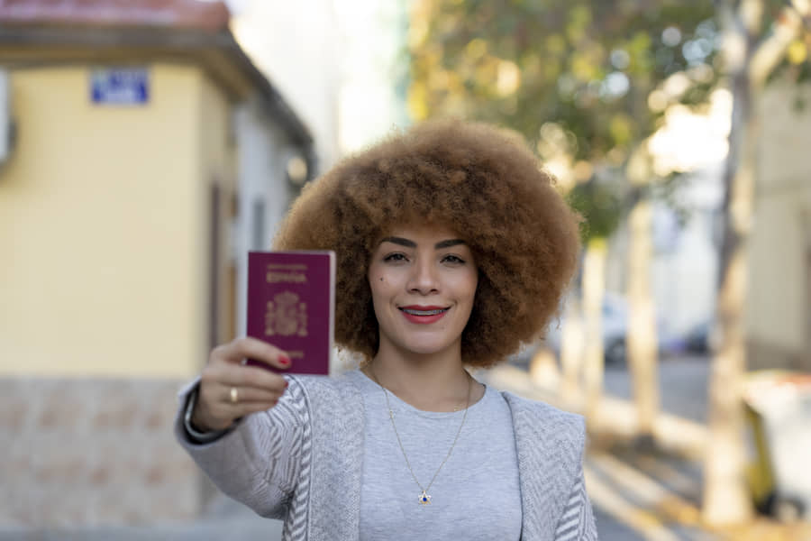 Woman showing her spanish passport